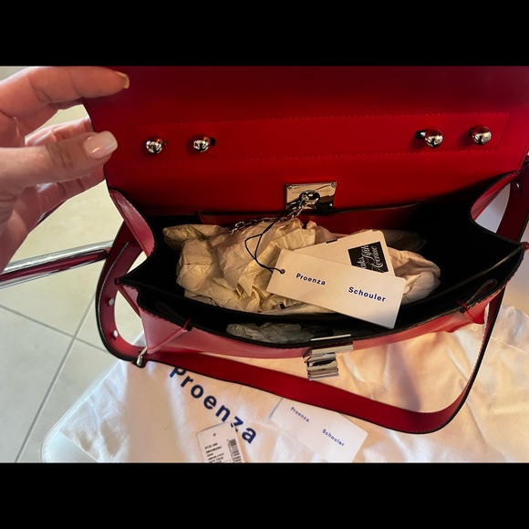 Proenza SchoulerDepth:4.75"
Strap 20"
Width:12.5"
Handle Drop:5.25"
Height:9.75” - Picture 7 of 10